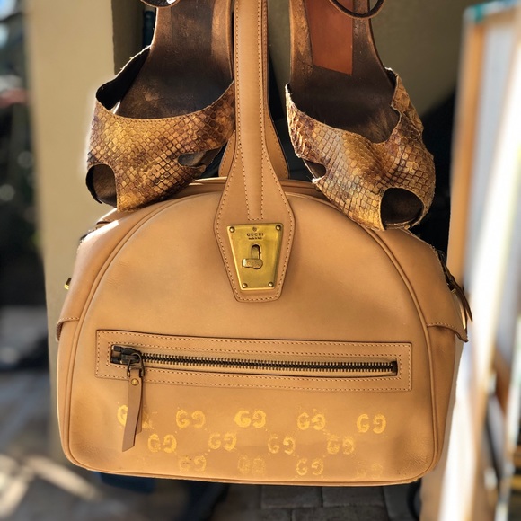 Gucci leather bag and python leather shoes.